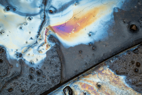 a pool of oil on a stone floor